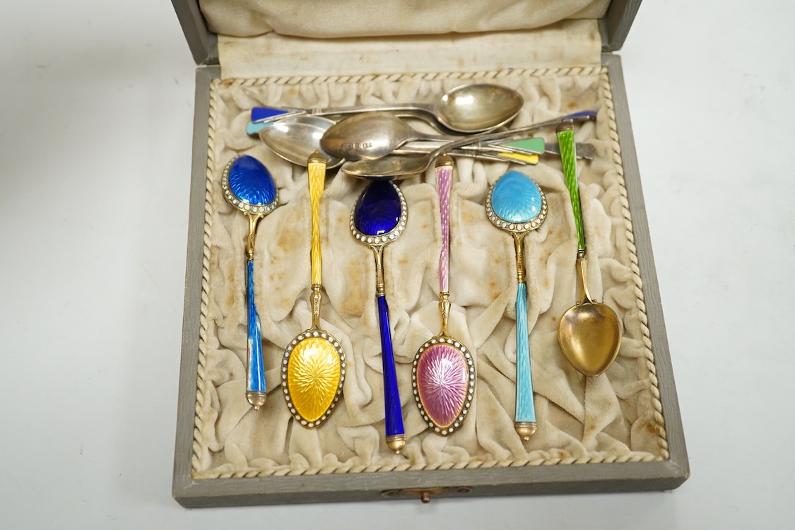 A cased set of silver Norwegian gilt 925 and polychrome enamelled coffee spoons(a.f.), 93mm, together with a set of six George V silver coffee spoons, with enamelled terminals, Deakin & Francis, Birmingham, 1933.